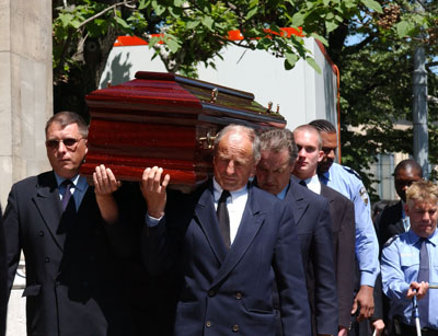 men carryng casket