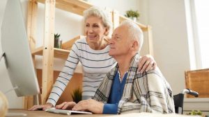 senior couple searching online for final expense insurance plans