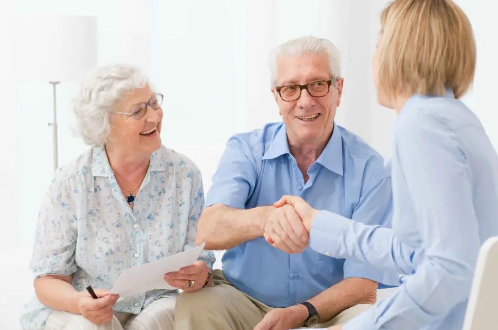 Seniors Shaking hands with Issuance agent
